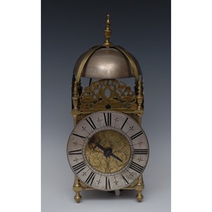 A 17th century brass hook and spike lantern clock