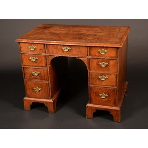 An early 18th century walnut kneehole desk