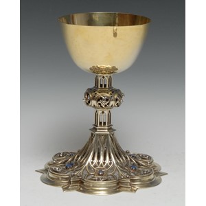 A fine Gothic Revival diamond and sapphire mounted silver-gilt ecclesiastical Communion chalice