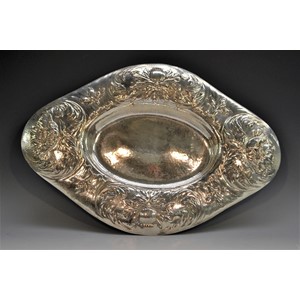 Gilbert Marks - a large Arts and Crafts Britannia silver navette shaped table centre dish