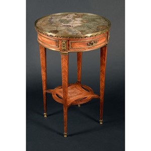 A Napoleon III feldspar and gilt metal mounted kingwood circular centre table