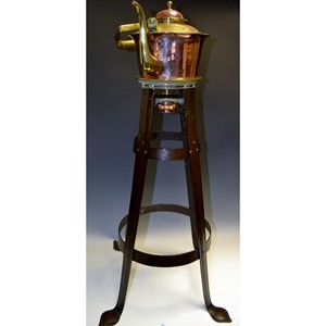 An Arts and Crafts brass and copper tea kettle on stand