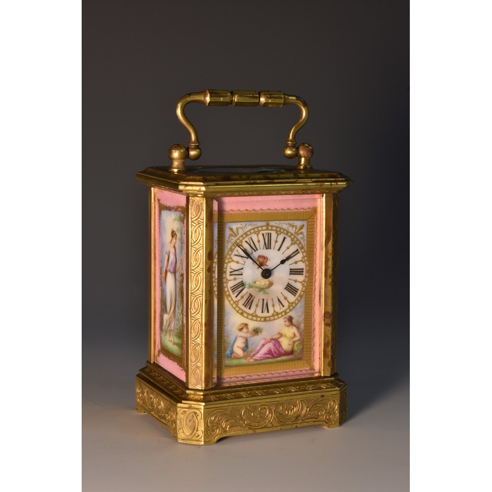 A 19th century French porcelain canted rectangular miniature carriage timepiece