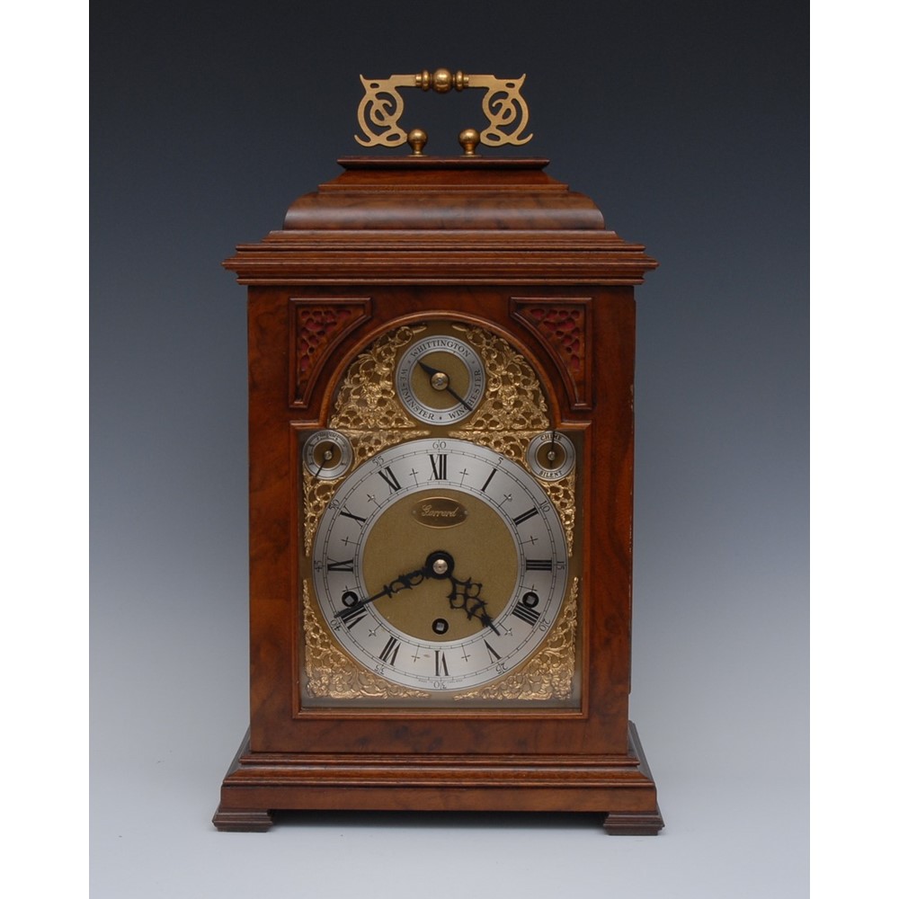 An 18th century style English walnut three-train musical bracket clock