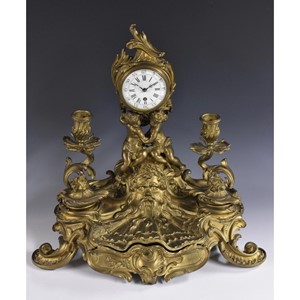 A sculptural 19th century French gilt metal combination desk stand and timepiece