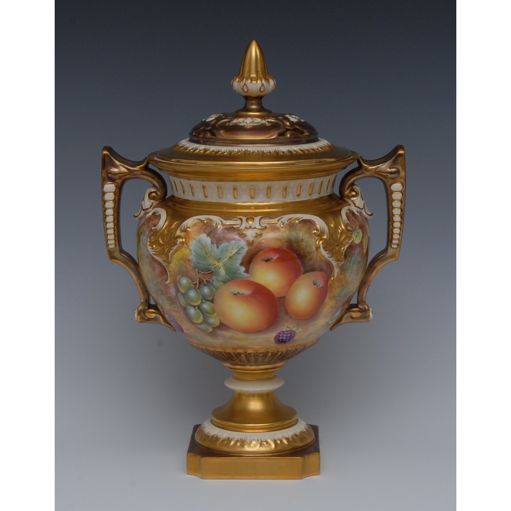 A Royal Worcester pedestal lobed ovoid two handled vase and cover