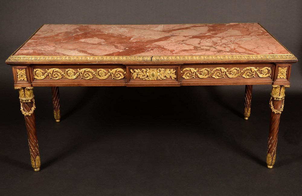 A substantial Napoleon III ormolu mounted mahogany rectangular library centre table