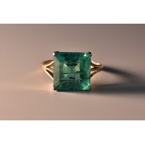 A Columbian square emerald cut emerald solitaire ring