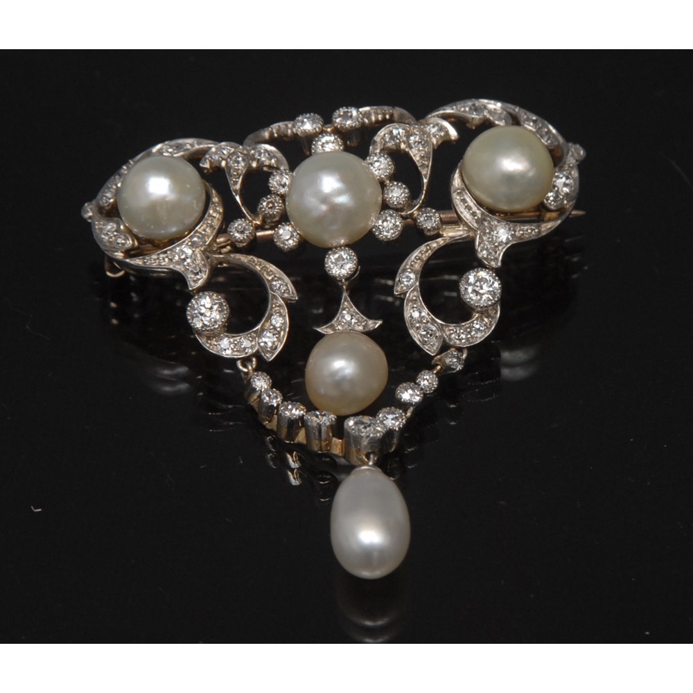 An Edwardian pearl and diamond brooch