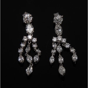 A pair of diamond encrusted triple drop earrings