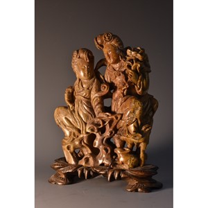 A Chinese soapstone carving of Guanyin and companion