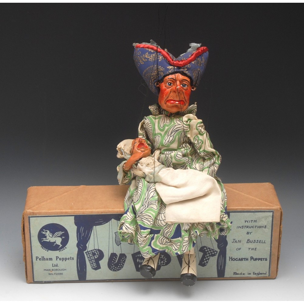 SL Duchess with Baby - very rare to find, and even rarer to have the baby with her, from Lewis Carroll's illustrations for novels Alice's Adventures in Wonderland and Through the Looking Glass - Pelham Puppets SL Range, solid moulded 'Gill Leeper' head with painted features, blue eyes, composite hands, metal strip knee joints, wearing a cream long dress applied with green, black and blue pattern and a large stuffed hat, boxed, early 1950's