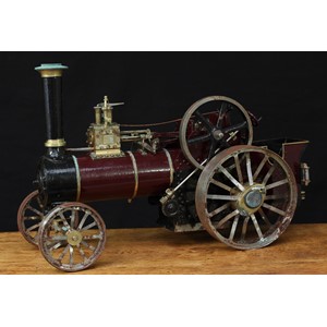 Charles Burrell & Sons Ltd (Engineers, Thetford Norfolk) - a scratch-built live steam agricultural traction engine, unnamed but based on the Prince (7HP) single cylinder tractor, approximately 1 inch scale, maroon livery, single brass topped chimney, rectangular brass plaque to side, 51cm long