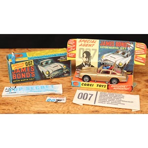 Corgi Toys 261 Special Agent 007 James Bond's Aston Martin D.B.5. from the James Bond film "Goldfinger", gold body with red interior, wire spoke wheels, James Bond and seated plastic bandit figure to interior, boxed with inner cardboard pictorial display stand, 'secret instructions' with packet, spare plastic bandit figure and 007 badge
