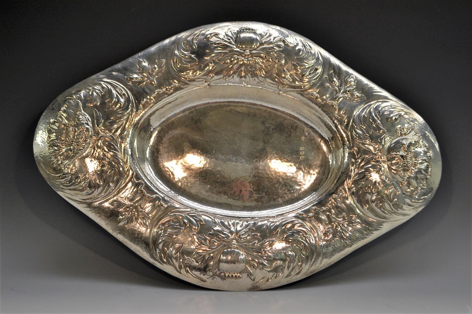 Gilbert Marks - a large Arts and Crafts Britannia silver navette shaped table centre dish