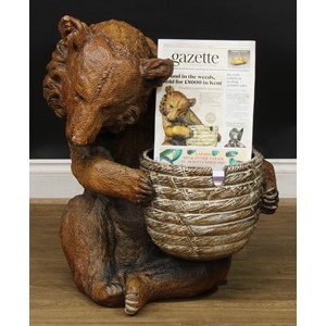 A substantial Doulton Lambeth salt glazed stoneware model, of a seated brown bear holding an upturned bee skep, possibly by Mark V. Marshall, impressed mark, 73cm high, 59cm wide, 65cm deep