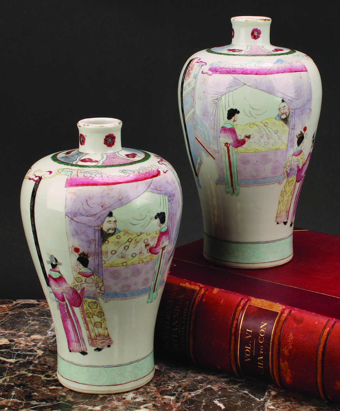 A pair of Chinese meiping vases, decorated in muted polychrome enamels, of a domestic interior, with a figure attended to in bed, 24cm high, six character mark, 19th century or earlier