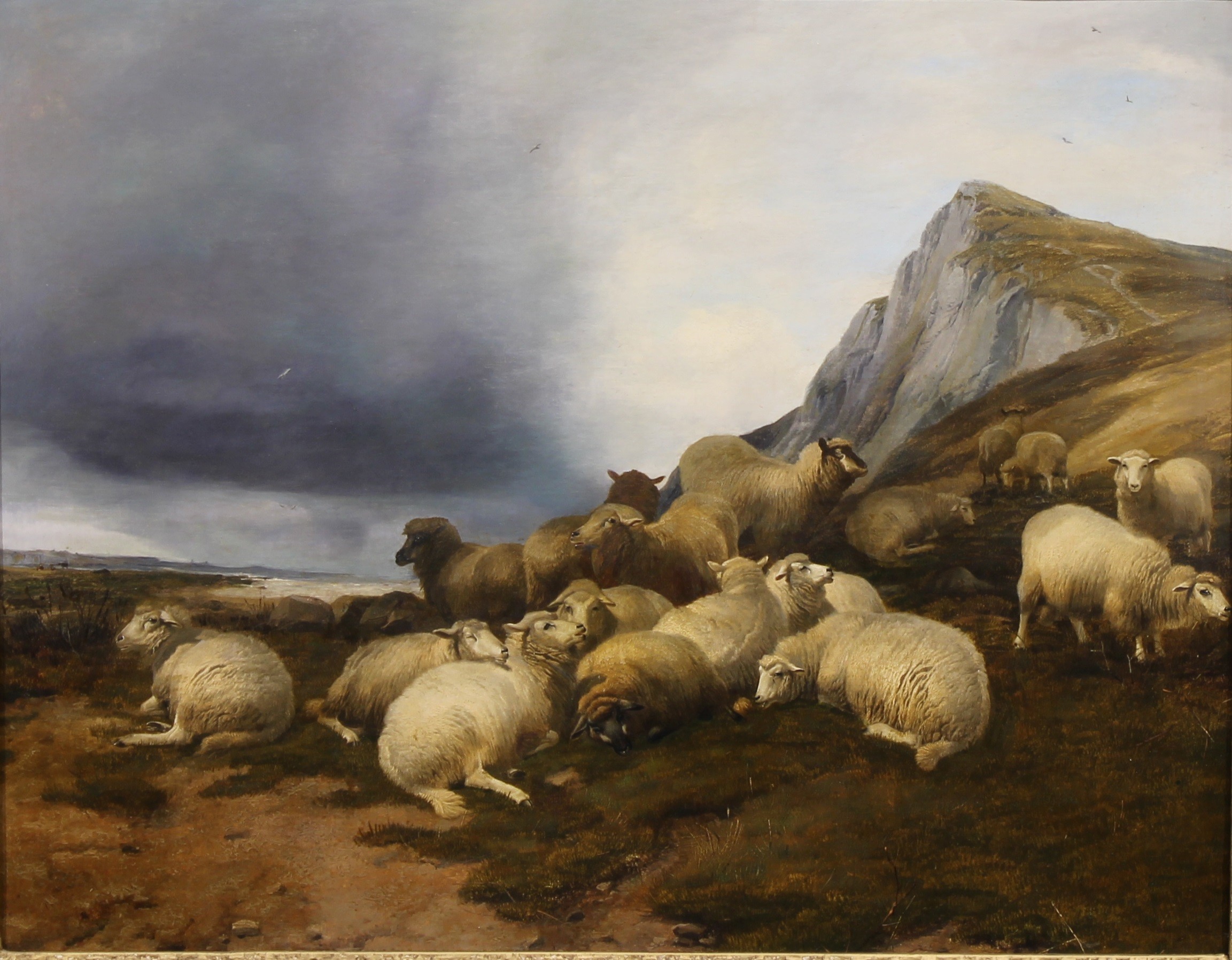 Thomas Sidney Cooper (1803-1902), Sheep in Coastal Landscape, faintly signed, the mount inscribed T. SIDNEY COOPER, R.A., 1873, oil on canvas, 58.5cm x 74.5cm