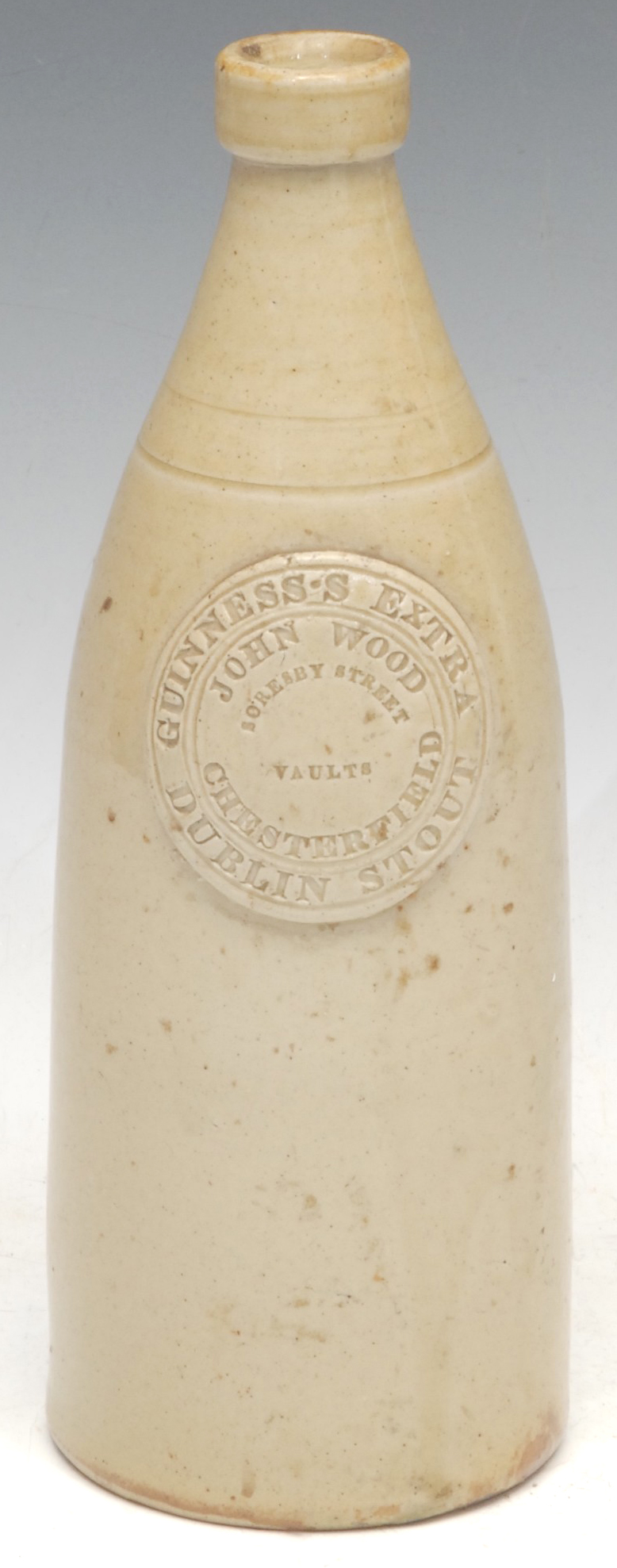 Advertising, Bottles - a rare slip glazed slab sealed stoneware porter, applied circular seal impressed 'John Wood, Soresby Street Vaults, Chesterfield, Guinness's Extra Dublin Stout', 25cm high, mid 19th century