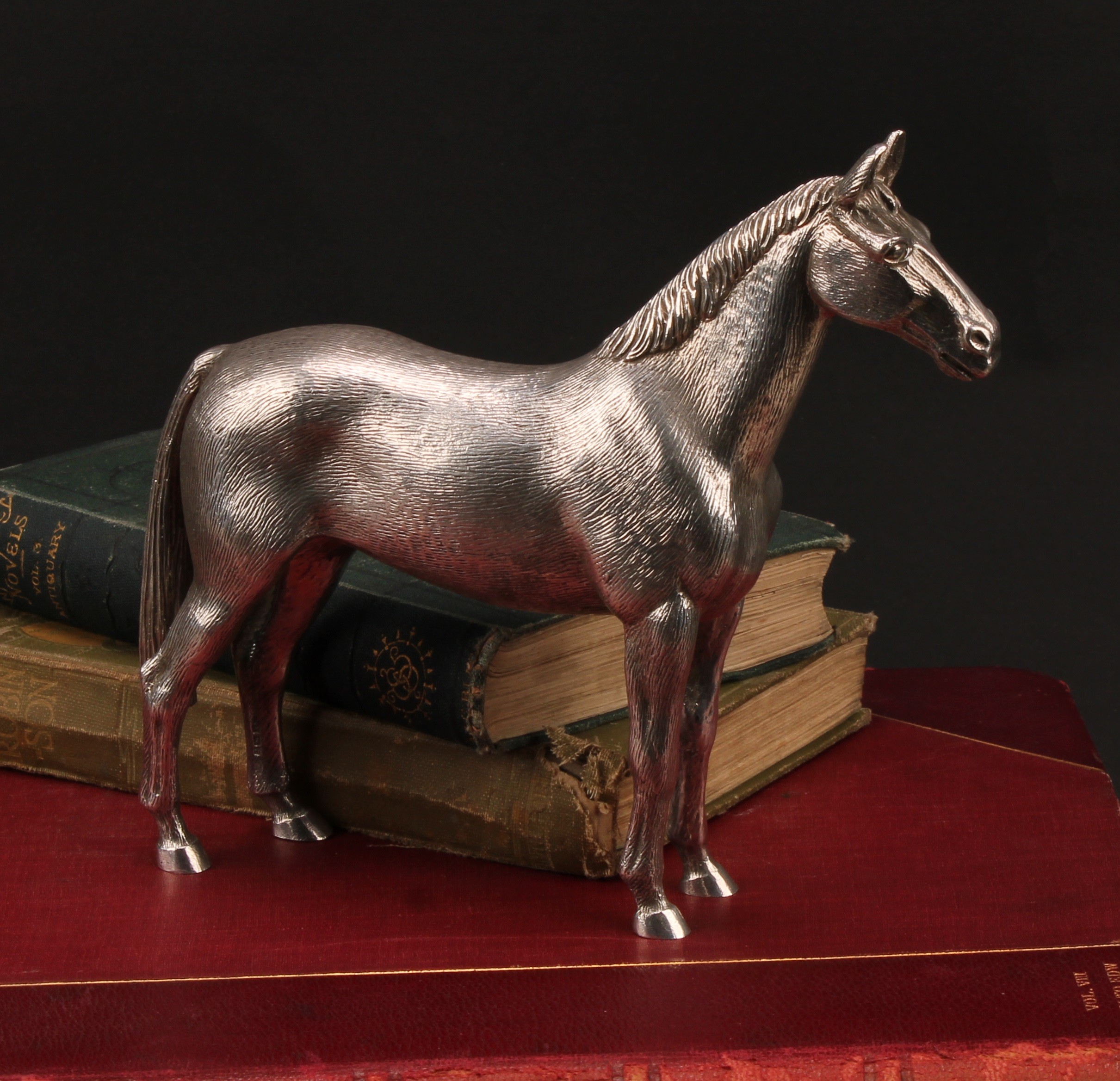 An Elizabeth II cast silver model, of a horse