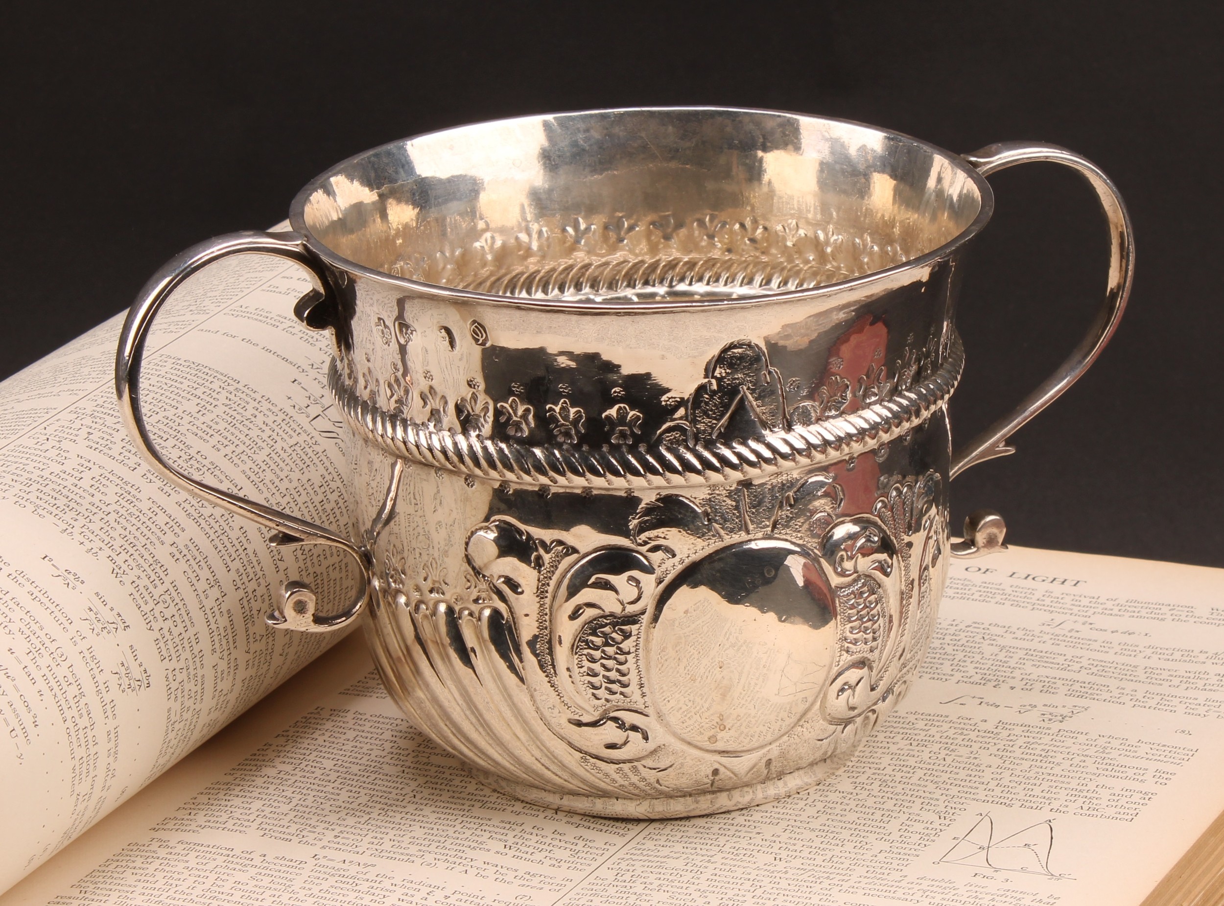A large Queen Anne silver porringer