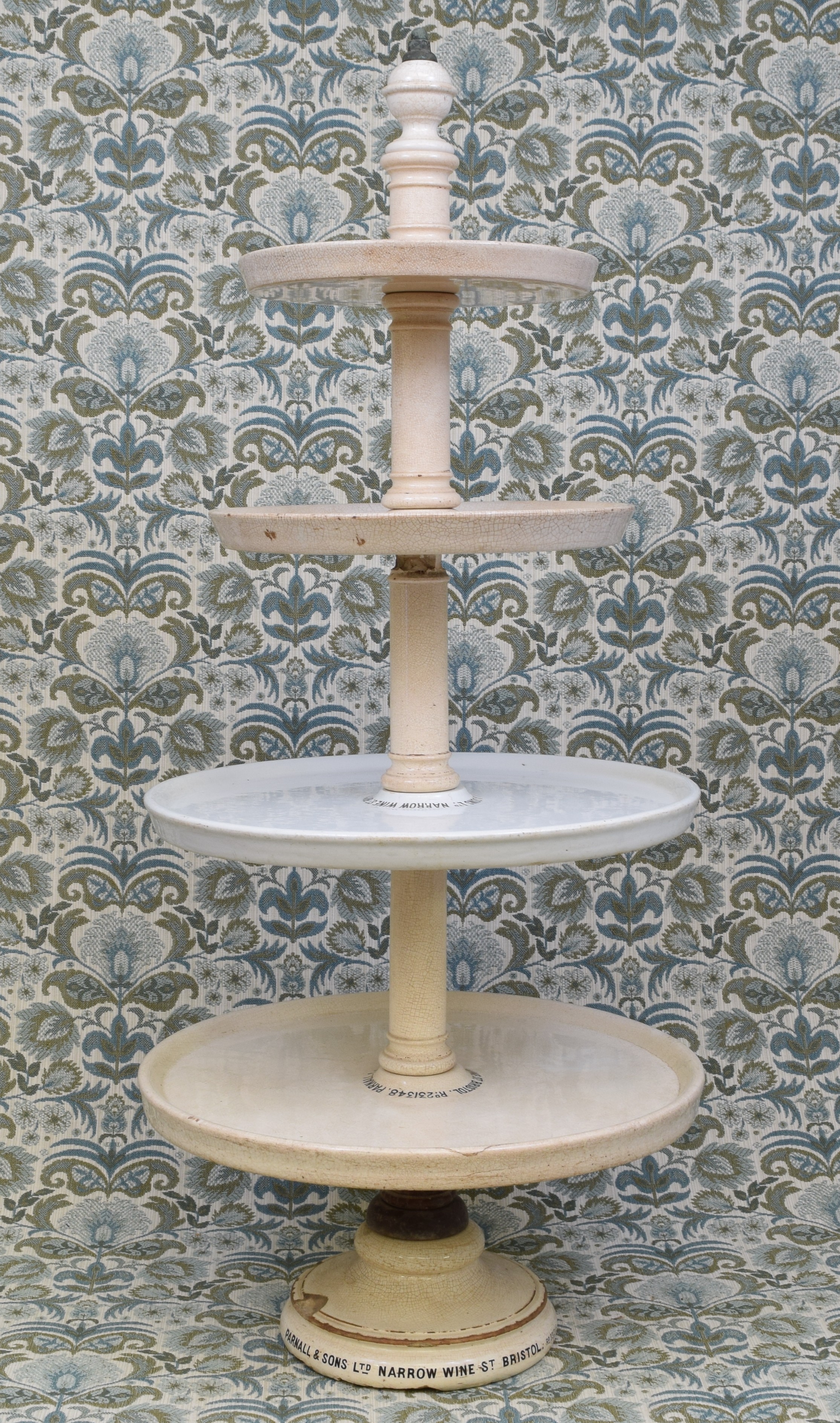 A late Victorian white ironstone butcher, baker or cheesemonger shop display stand