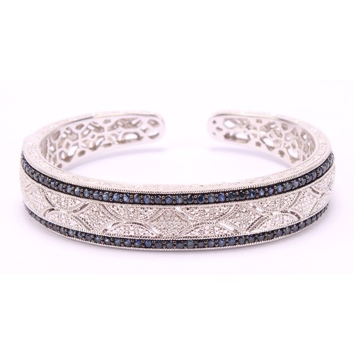 A Macy & Co Art Deco style silver, diamond and sapphire hinged cuff bracelet