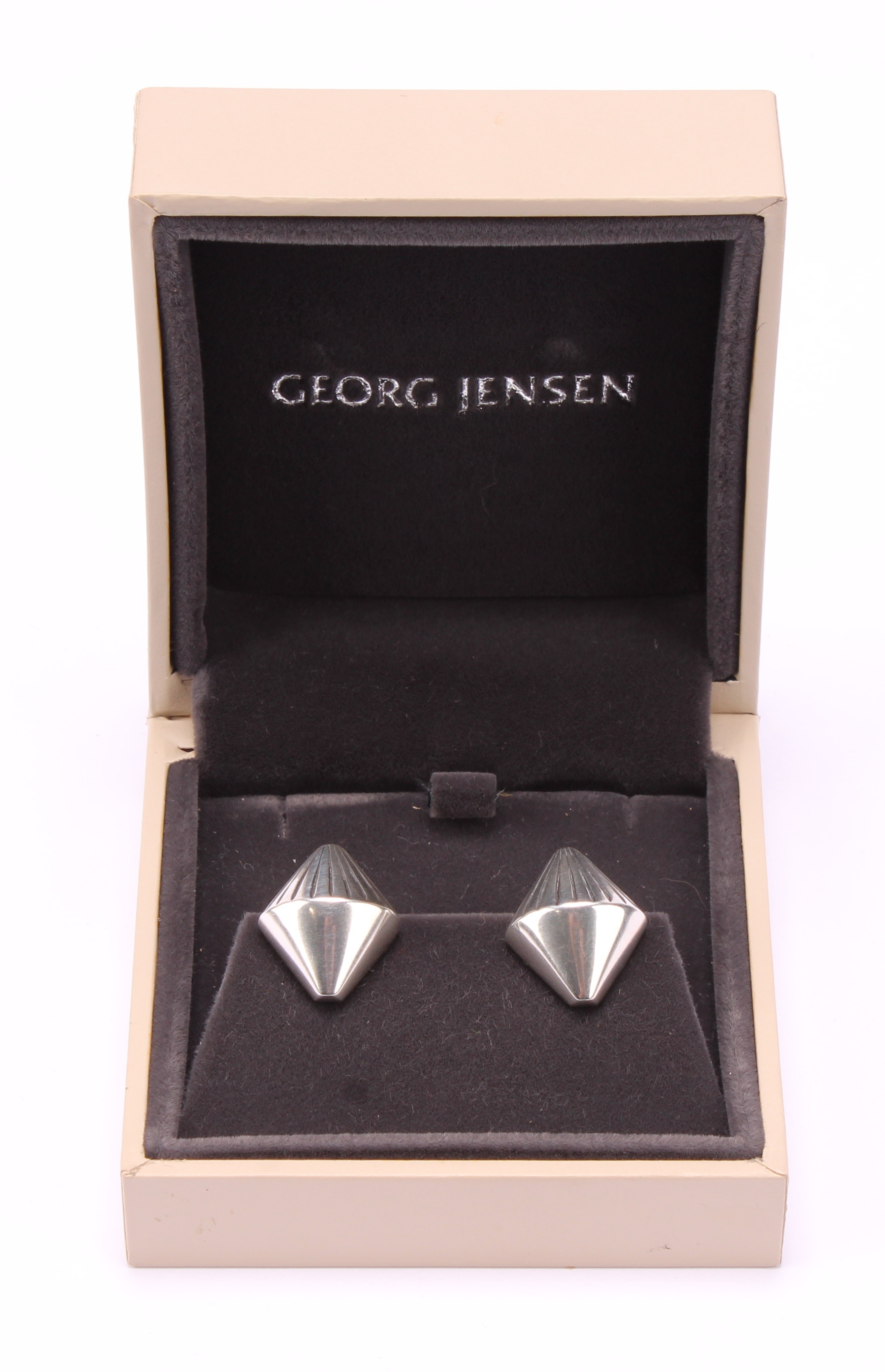 Georg Jensen - a pair of Danish sterling silver earrings or studs, shape no.112, designed by Arno Malinowski, boxed