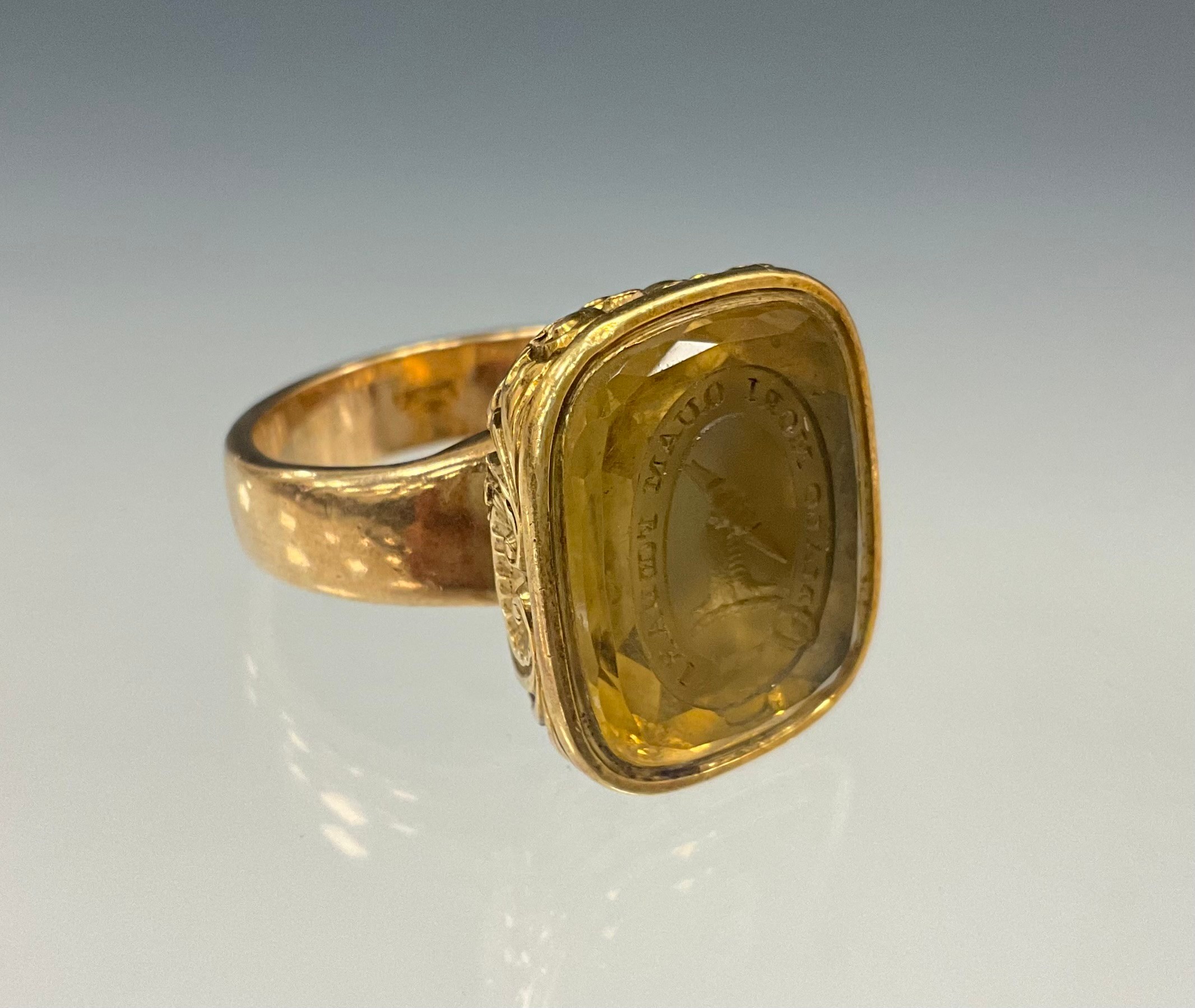 An Order of Ermine pale yellow citrine intaglio seal stamp signet ring, with latin inscription Malo mori quam foedari" , translating to english ("I would rather die than be dishonored") 