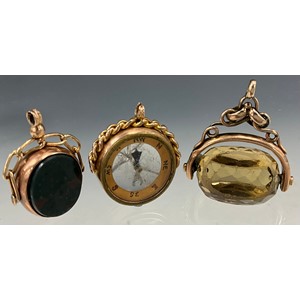A George V 9ct rose gold mounted compass Chester 1920, 9.1g gross; revolving bloodstone and sardonyx seal stamp, Chester 1920, 4.8g gross; another, pale yellow citrine with unmarked yellow metal mount