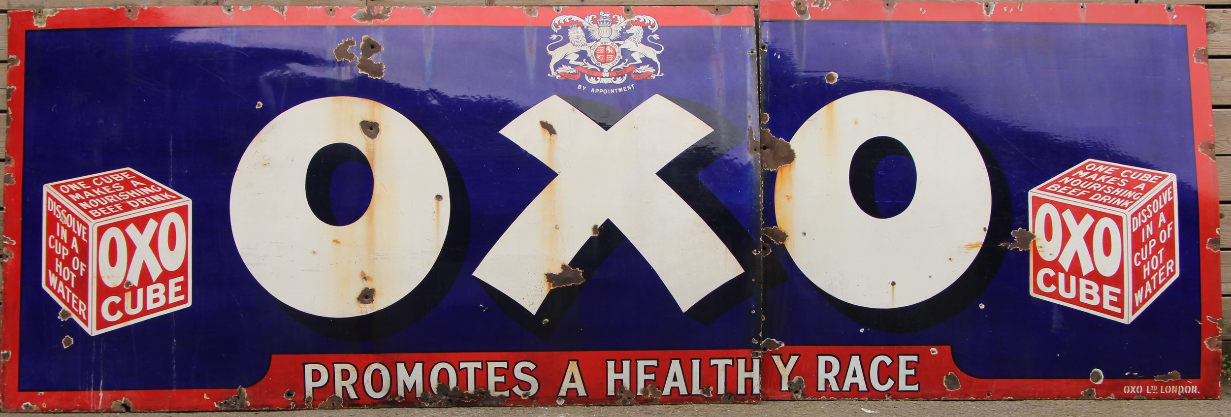 A large two piece rectangular shaped pictorial 'OXO' enamel sign