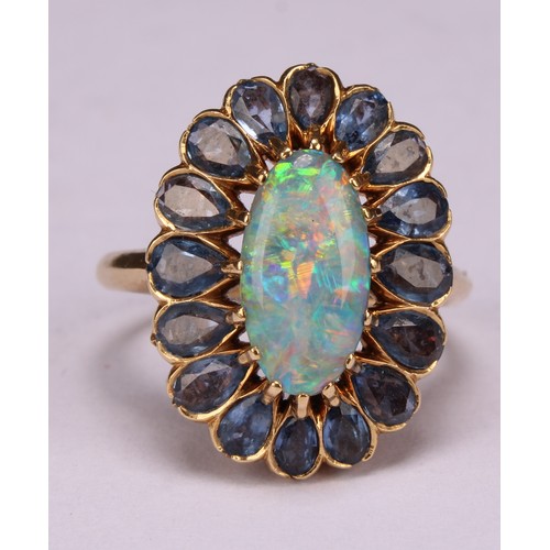 An 18ct gold oval opal and tourmaline cluster ring