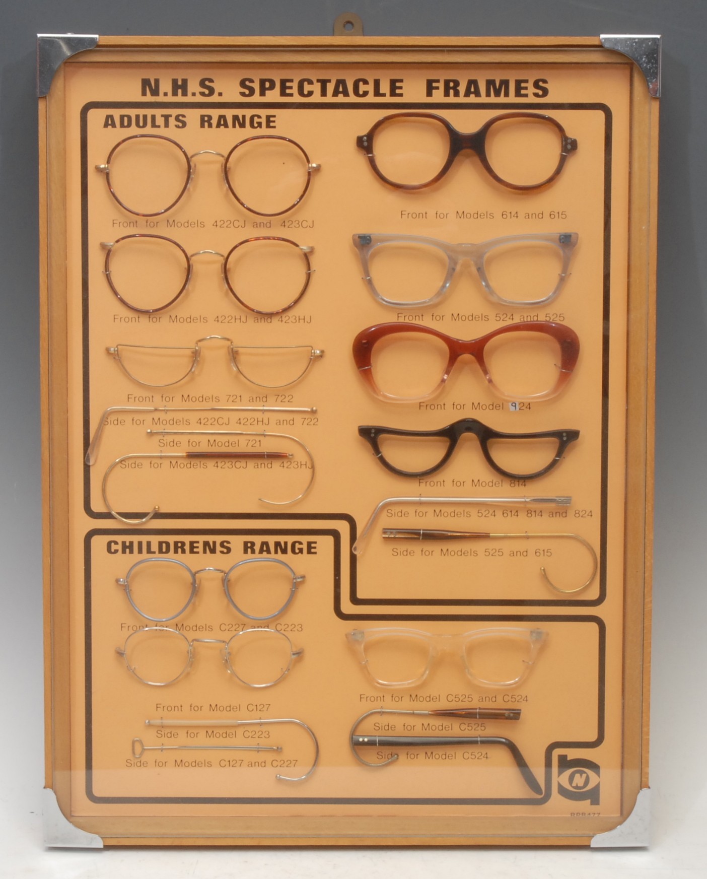 An optician's advertising diorama, produced by the NHS, containing specimen examples of 1960s spectacles