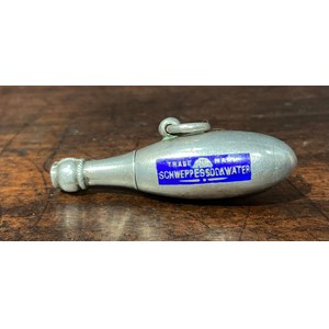 A Novelty advertising silver and enamel Schweppes soda water retractable pencil, c.1910