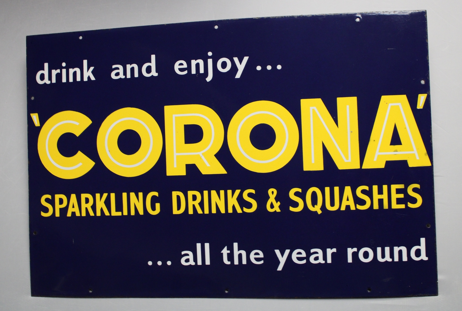 A mid 20th century enamel sign, Corona Sparkling Drinks & Squashes