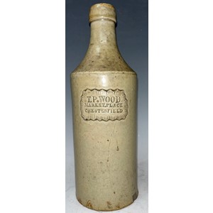 A slip glazed slab sealed stoneware porter, 'T. P. Wood, Market Place, Chesterfield', mid 19th century