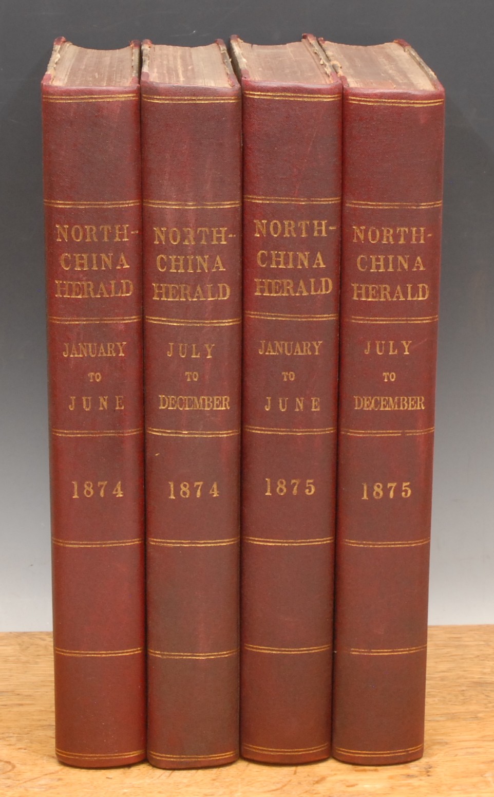 China, Newspapers – The North China Heralds: Supreme Court and Consular Gazette, A Complete Record of Political and General News and Law Reporter to HBM.s Supreme Court for China, [&] Japan, Shanghai, 1874-75, 4 vols., Vol. XII (NS) 1/1/1874-30/6/1874, iv + 604pp; Vol. XII (NS) 1/7/1874-31/12/1874, iv + 652pp, Vol. XIV (NS) 1/1/1875-30-6-1875, v + 652pp; Vol. XV (NS) 1/7/1875-31/12/1875, iv + 664pp, 4to, bound uniform half red moquette over marbled boards, gilt lines and titles to spine (4)