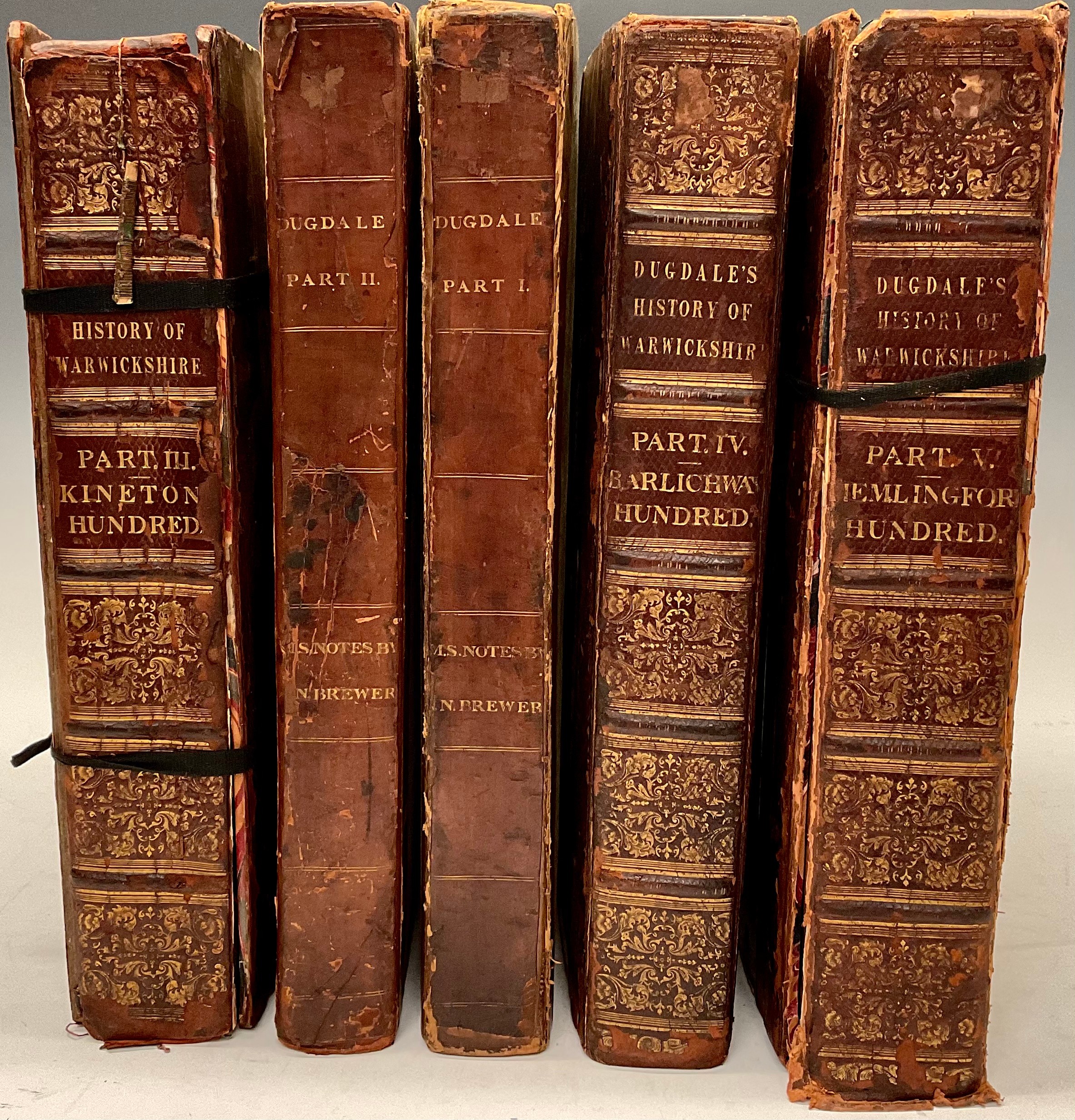 Grangerised/Extra-Illustrated Copy, Dugdale (Sir William), The Antiquities of Warwickshire, harlequin five volumes, mixed editions, volumes I-II 1765 edition, [Coventry: John Jones], lacking title-pages and all after p. 786, volumes III-V 1730 edition of volume II only, London: John Osborn and Thomas Longman […] 1730, all interleaved and with numerous additional engravings, lithographs, aquatints, portraits (including various depictions of Shakespeare), a few drawings, printed ephemera and occasional manuscript notes bound in or loosely inserted, volumes I & II rebacked early 19th century calf gilt over papered boards, volumes III-V rebacked Regency half-diced russia (split, some covers detached), crown folios (41.2cm x 26cm & 40.2cm x 25.7cm), [5]   Provenance: 1) Matthew Holbeche Bloxam (1805-1888), Warwickshire antiquary and archaeologist, his book label to each pastedown; 2) by bequest to his alma mater, The Rugby School Library, their armorial bookplates to each pastedown.