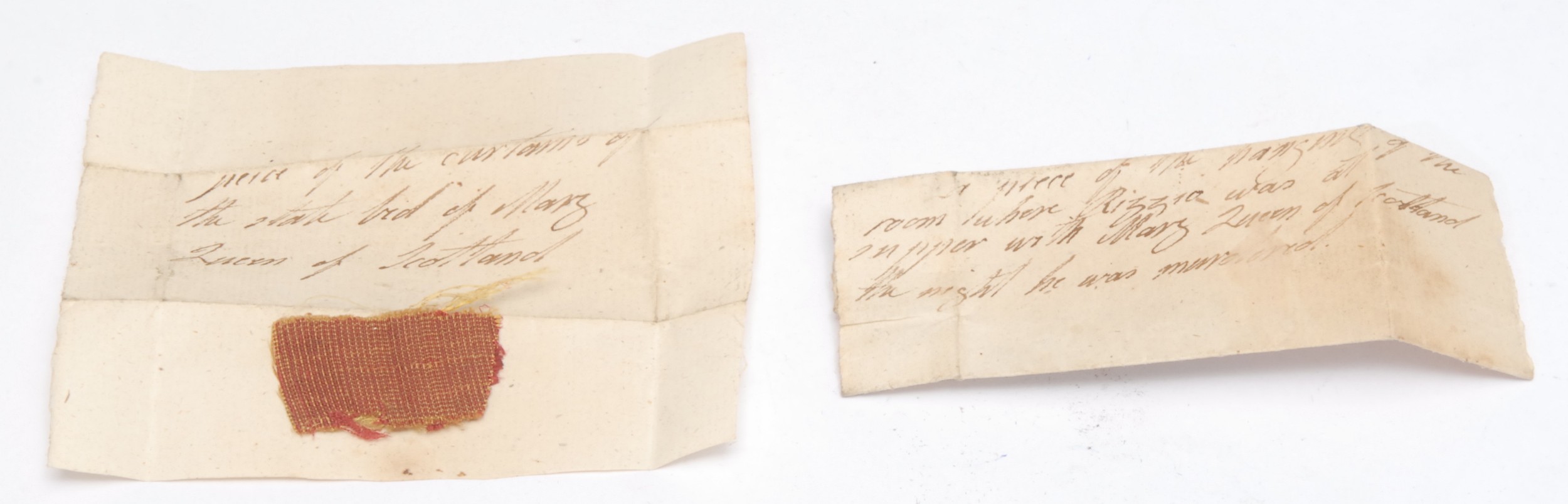 Mary Queen of Scots - an 18th century manuscript containing a fragment of the curtains of the state bed of Mary Queen of Scots at the Palace of Holyroodhouse, Edinburgh, inscribed A PIECE OF THE CURTAINS OF THE STATE BED OF MARY QUEEN OF SCOTLAND, 3.5cm x 7cm; another, a fragment of tapestry from the Supper Room in the Palace of Holyroodhouse, where Queen Mary dined with David Rizzio on Saturday, 9 March 1566, the night of his murder, inscribed A PIECE OF THE HANGING OF THE ROOM WHERE RIZZIO WAS AT SUPPER WITH MARY QUEEN OF SCOTLAND THE NIGHT HE WAS MURDERED, 3.5cm x 6cm (2)