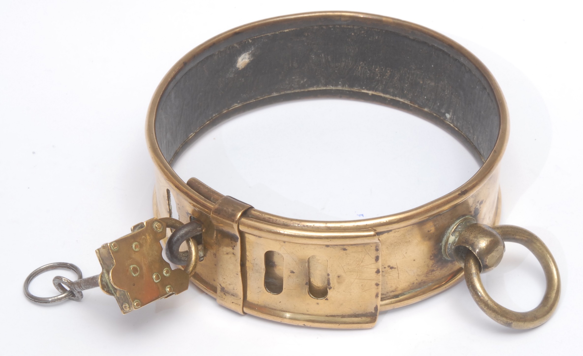 Canine Interest - a large 19th century brass dog collar, inscribed Knowles King, Maidstone, 15.5cm diam  Reference: Census records show that a Knowles King (1809 - 1871) was resident in the Kent during this period, having been born at Wateringbury and later living at Maidstone, where his son, also Knowles, was born in 1834.