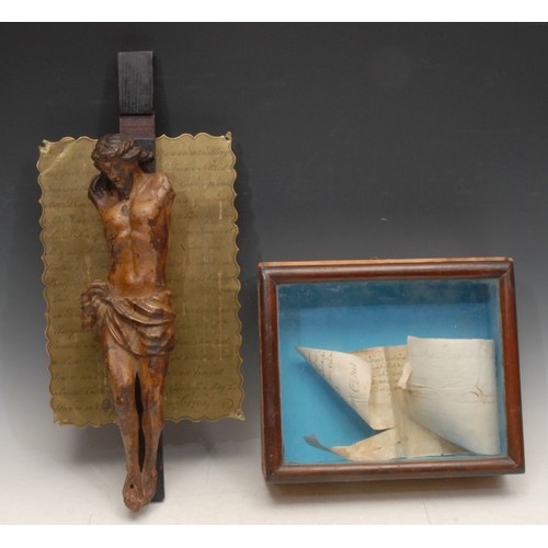 A 17th century carved and polychrome painted corpus Christi, the brass mount inscribed 'This crucifix was given by Pope Innocent X about anno domini 1652 to Lord John Somerset second son of the Marquess of Worcester, brother to the Duke of Beaufort which said Lord John Somerset in time of the usurpation of Cromwell was forced to leave England and went to ask relief of several Catholick [sic] princes in Europe. Upon whom the King of France settled six hundred pounds per year and afterwards went to Rome and received from Pope Innocent X the said crucifix which was given to John Vincent Gandolfi by Mrs Carolina Brickenden, sister of Mrs Anne Somerset, godmother to said John Vincent Gandolfi May 2 1765,' 14cm high overall