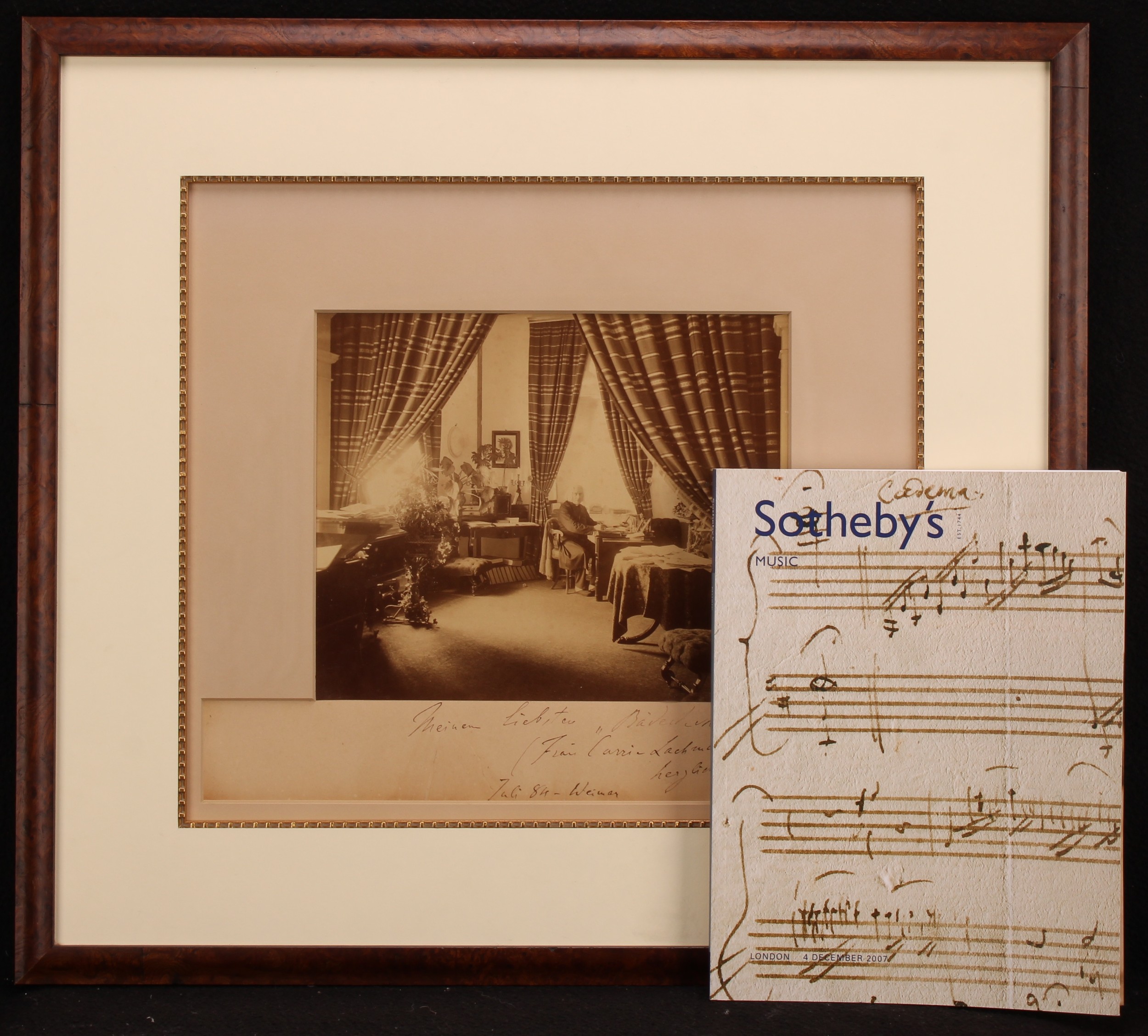 Franz Liszt - a large photograph, signed and inscribed, showing Liszt in his study at Weimar, by Louis Held, blind stamped Louis Held Weimar 1884, the mount inscribed Meinem Liebster Bädedecker—(Frau Carrie Lachmund) herzlich ergebend F Liszt, Juli 84-Weimar, framed, 49.5cm x 55cm overall  Louis Held (1851-1927) was court photographer at Weimar from 1882: "He forever changed the field of Liszt iconography. Held's portraits of Liszt...are unsurpassed in both content and form" (Alan Walker, Franz Liszt. The Final Years (1996), p.7). Caroline Lachmund was the wife of the American pianist Carl Lachmund, one of Liszt's pupils at Weimar (Walker, p.419)  Provenance: Sotheby’s Music sale, London, 04 December 2007, lot 72.