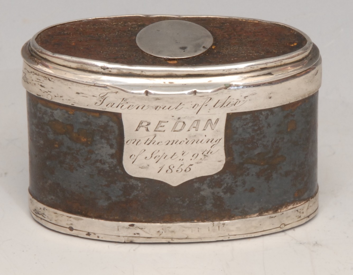 The Crimean War - a 19th century battlefield relic snuff box, formed from a section of Russian sabre scabbard, hinged cover, the silver coloured metal mount inscribed Taken out of the Redan, on the morning of September 9th 1855, 7.5cm wide