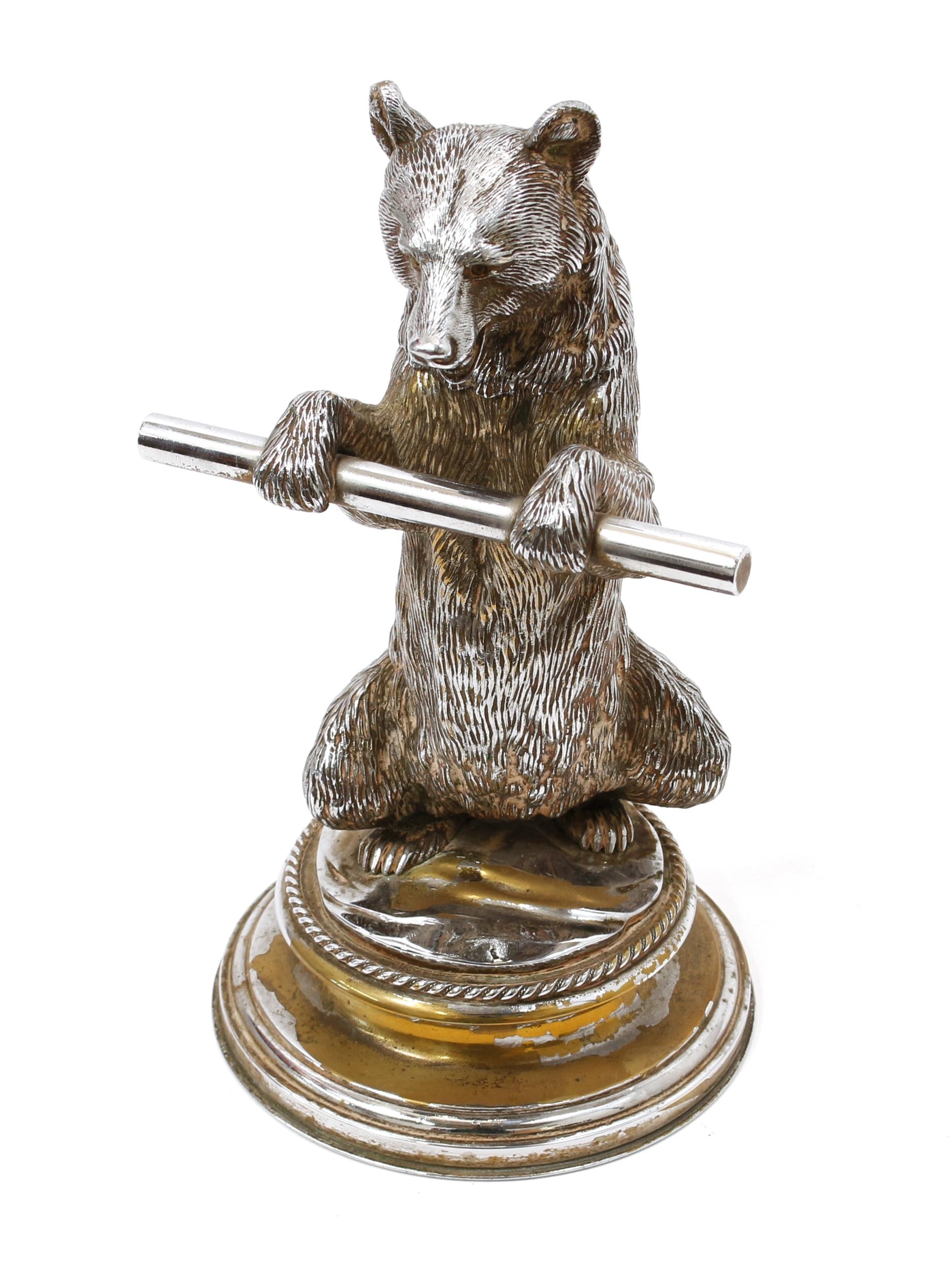 An early 20th century sculptural silver plated novelty inkwell, cast as a dancing bear, waisted circular base, 25cm high