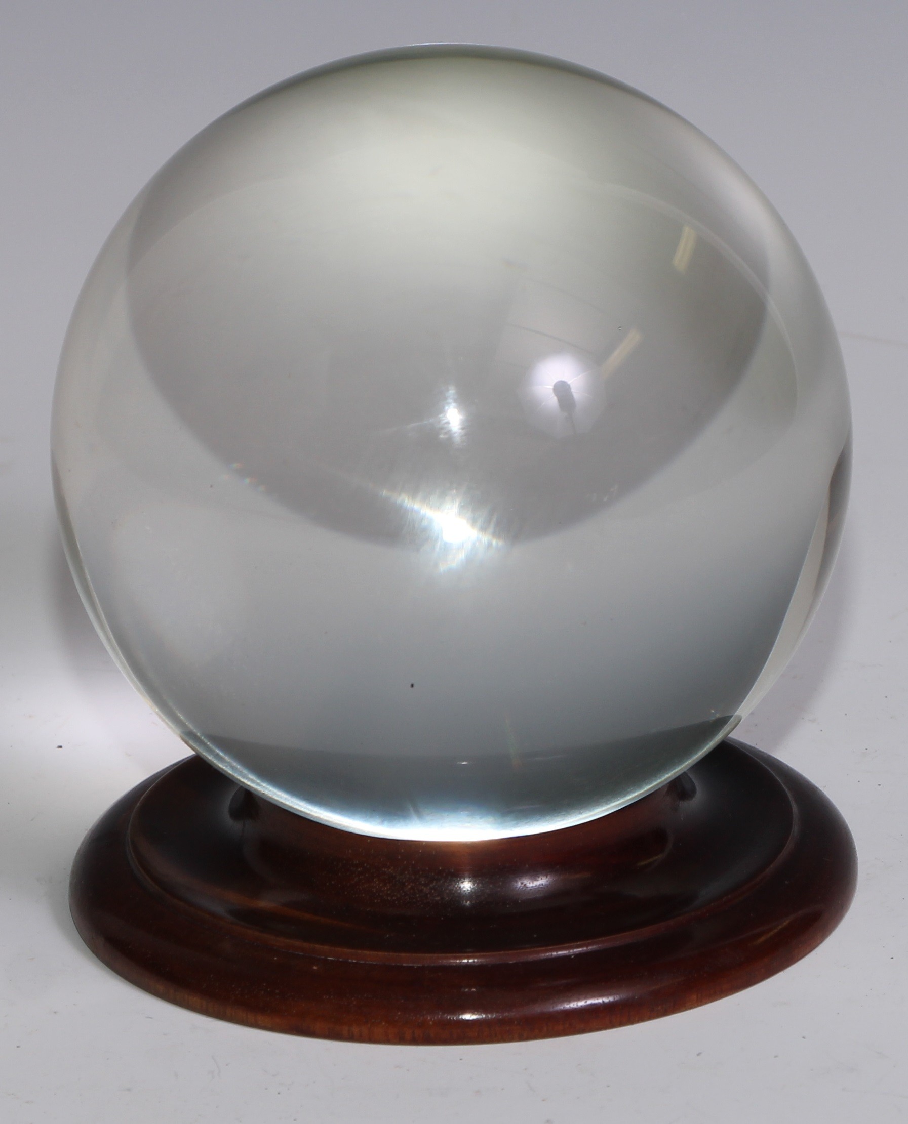 Mysticism and The Occult - a crystal ball, 11cm diam, turned mahogany stand