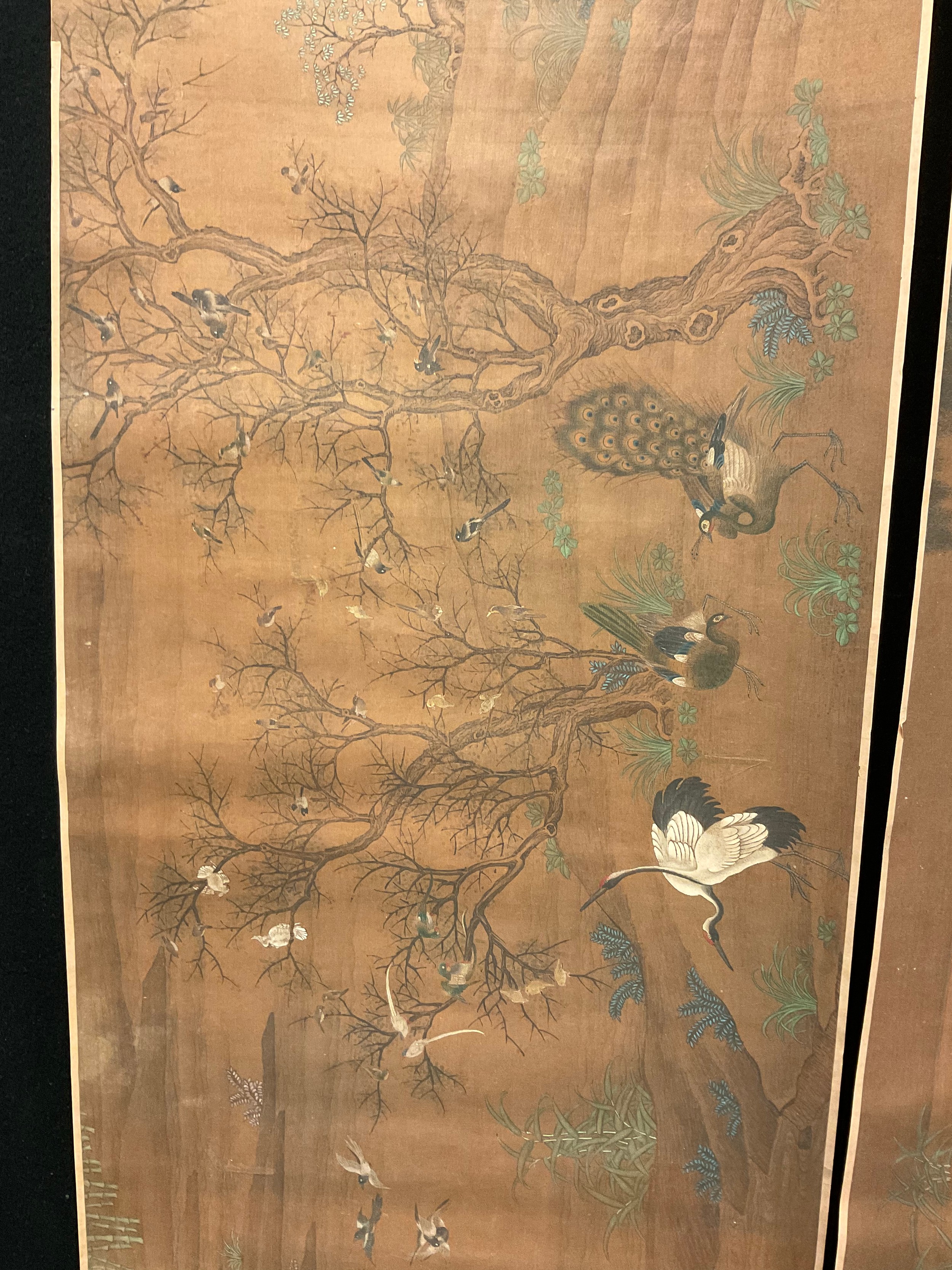 A Chinese scroll, pigments on silk, with with herons and peacocks, 41cm x 175cm x 51cm;  another, with ducks (2)
