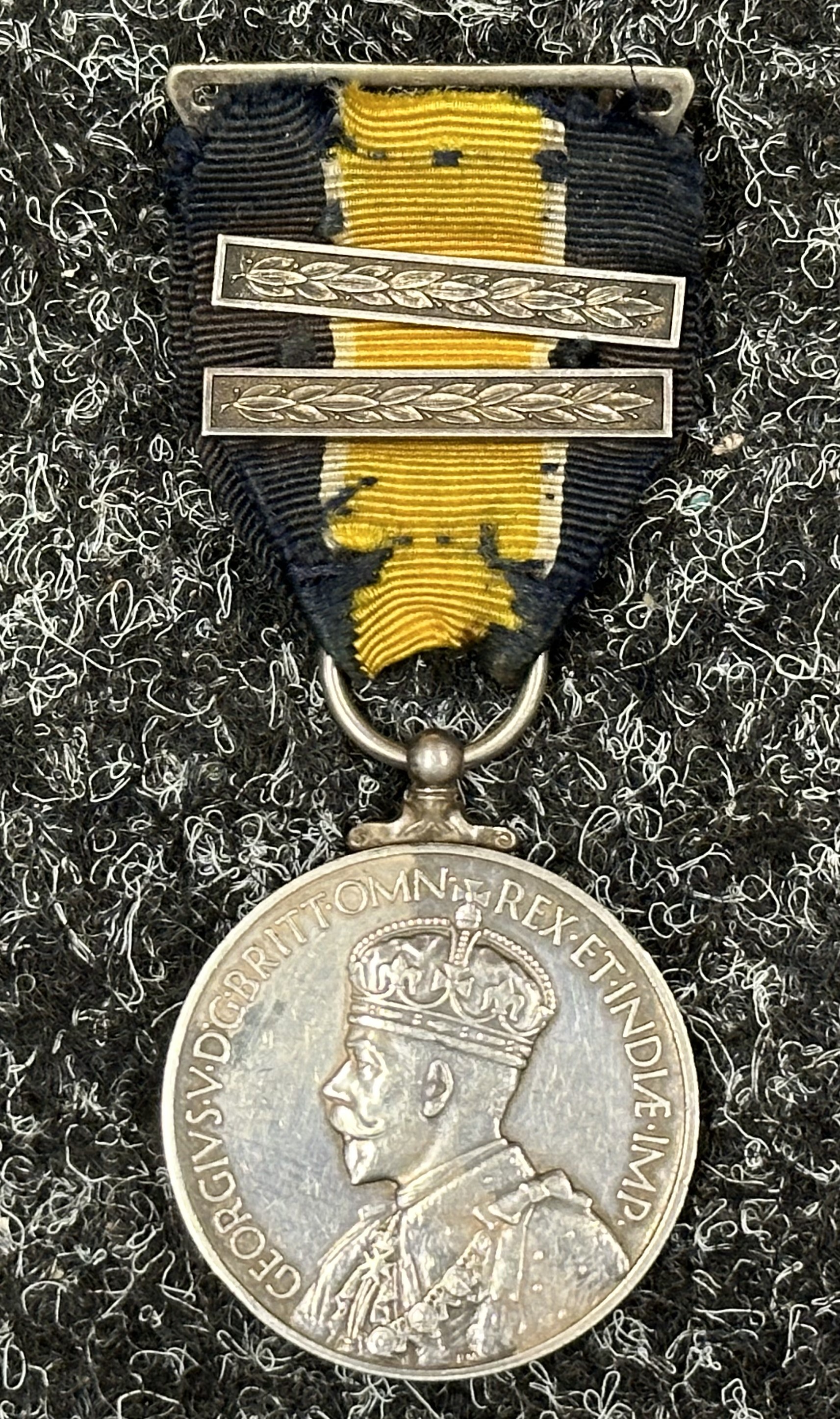 GR V Colonial Police Long Service and Good Conduct Medal with two bars to Insp. Fazal Ahmed, Hong Kong Police. Complete with ribbon and separate pin.