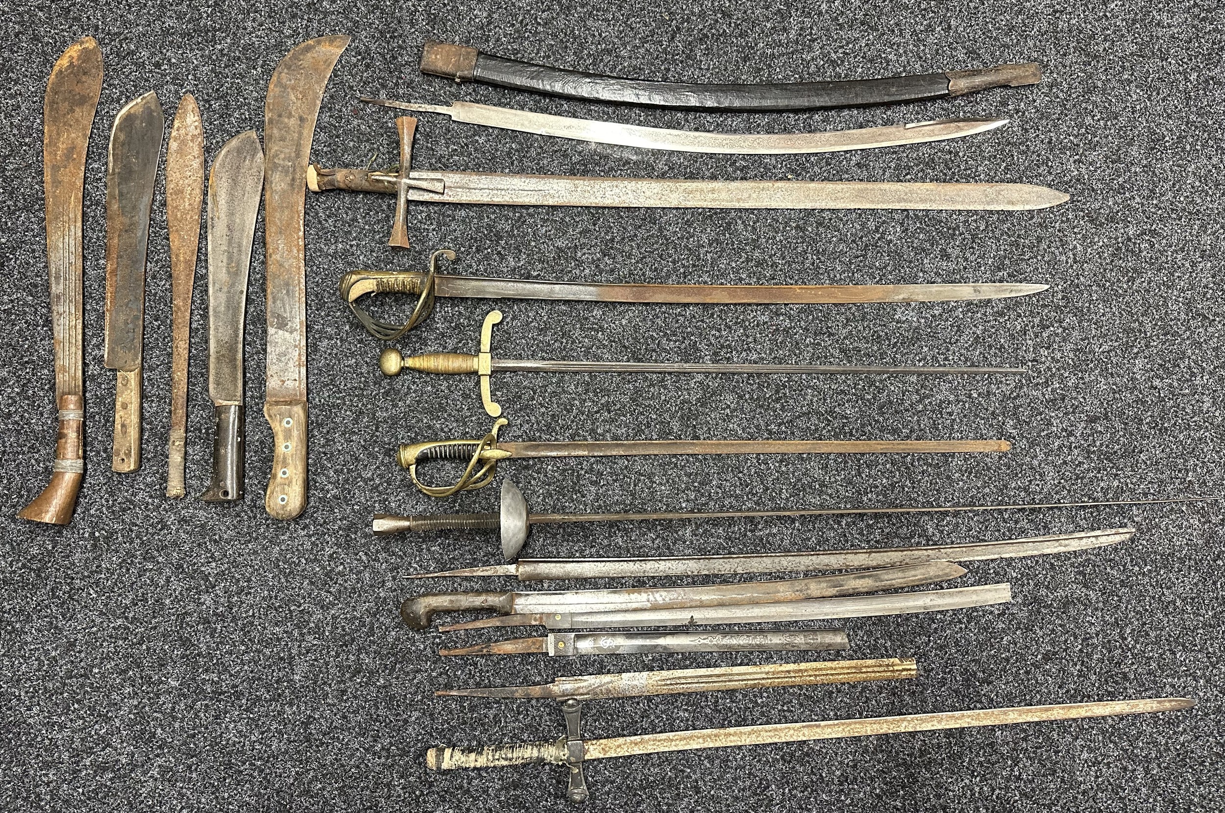 Collection of “Barn found” edged weapons, including a Sudanese Kaskara, etc.