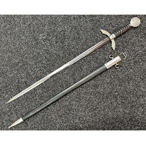 WW2 Third Reich Luftwaffe Officers Sword with double edged fullered blade 665mm in length, maker marked "SMF Solingen" along with Luftwaffe acceptance mark. Alluminium fittings, wire bound blue leather grip, pommel with Sunwheel Swastika. Overall length 850mm. Complete with blue leather covered scabbard with matching alluminium fittings and Sword hanger. New to the market, war souvenir of a British Serviceman.