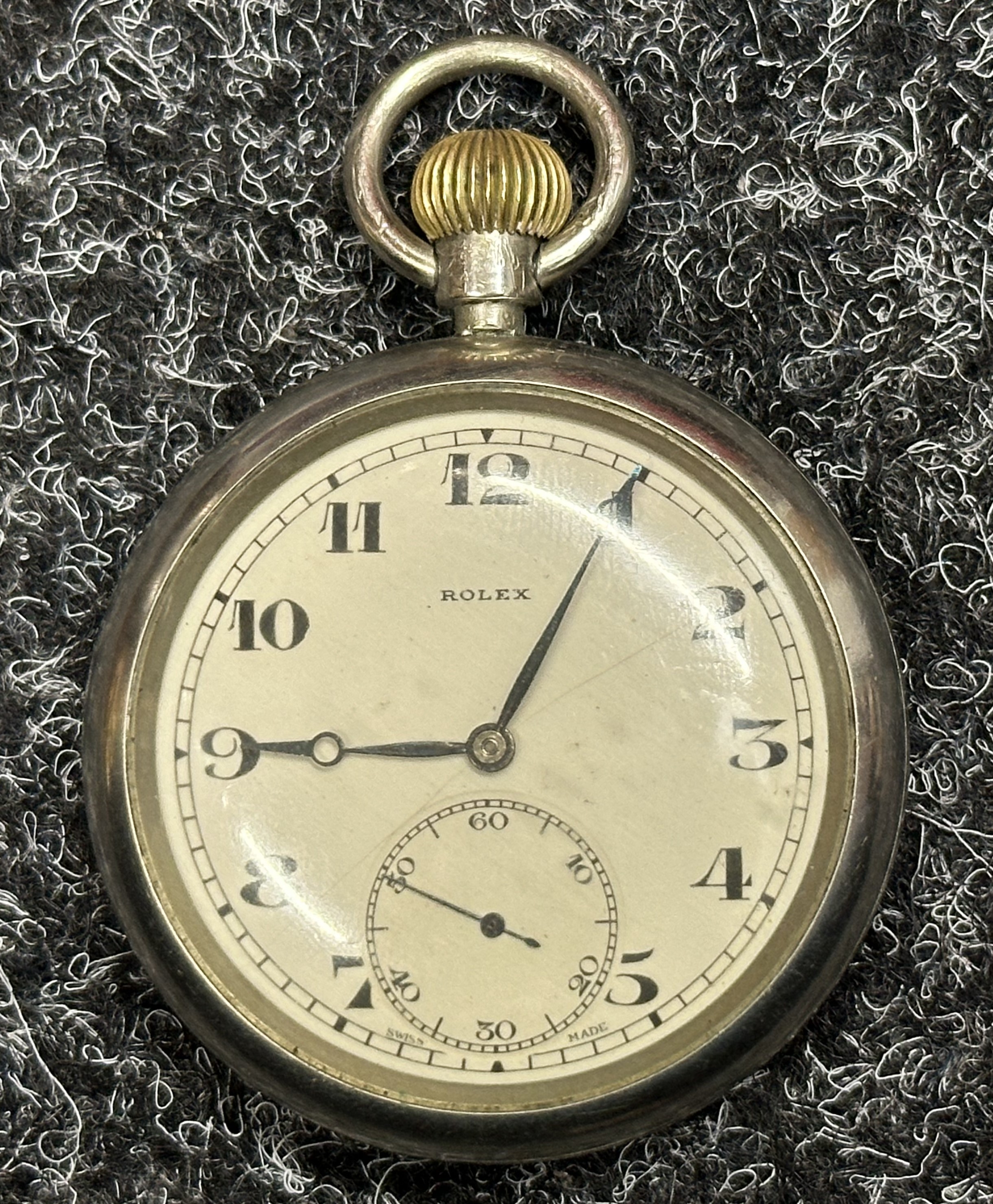 WW2 British GS MKII Pocket Watch by Rolex. White non luminous dial with Arabic Numerals. Separate seconds dial. Chrome plated case. Reverse is marked with WD Broad Arrow along with "GS MKII A54309". Runs and ticks would recommend a clean and service.